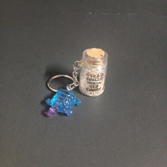 NWOT Clearwater Beach Florida Bottle Souvenir Key Chain  1.5" - Picture 1 of 3